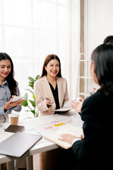 Modern youth are gathering, working as a team, and holding team meetings to achieve their goals.
