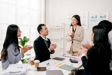 Modern youth are gathering, working as a team, and holding team meetings to achieve their goals.