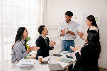 Modern youth are gathering, working as a team, and holding team meetings to achieve their goals.