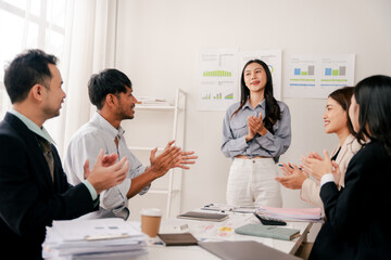 Modern youth are gathering, working as a team, and holding team meetings to achieve their goals.