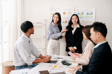 Modern youth are gathering, working as a team, and holding team meetings to achieve their goals.