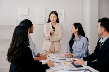 Brainstorming of young modern group. Team meeting to achieve goal. Business people discussing finance business and analysis. Teamwork concept in modern office. Calculating personal tax for client.