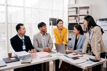 Brainstorming of young modern group. Team meeting to achieve goal. Business people discussing finance business and analysis. Teamwork concept in modern office. Calculating personal tax for client.