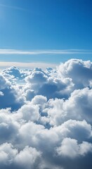 Serene Cloudscape: An Aerial View of Puffy Cumulus Clouds Under a Vivid Blue Sky