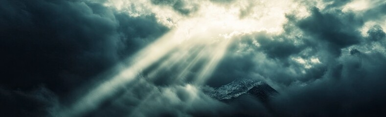 Beautiful mountain peak in the Himalayas, with the Annapurna mountain range in the background. Snowy peaks of the Himalayan mountains. Close-up view from top to bottom. A cloudy sky with rays of sunli