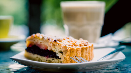 triangular piece of poppy pie with powdered sugar