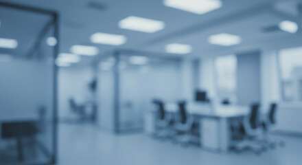 Fototapeta premium Blurred Office Interior with Desks and Chairs in Blue Tone