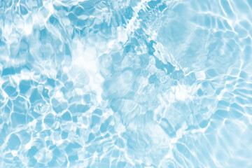 Blue water with ripples on the surface. Defocus blurred transparent blue colored clear calm water surface texture with splashes and bubbles. Water waves with shining pattern texture background.
