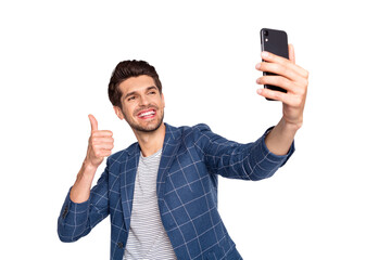 Portrait of his he nice attractive trendy stylish cheerful cheery glad businessman wearing blue checked blazer taking making selfie showing thumbup isolated over light white pastel background