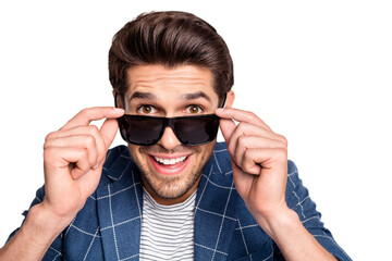 Close-up portrait of his he nice attractive lovely charming cheerrful cheery funny amazed freelancer wearing blue checked blazer cool new putting of specs isolated over light white pastel background