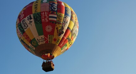 Colorful Hot Air Balloon Flying in Blue Sky with Passengers Onboard