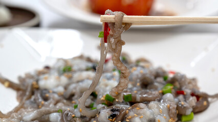 Korean food. Chopped live octopus
