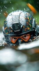 Close-Up of Paintball Player Submerged in Water Wearing Camouflage Helmet