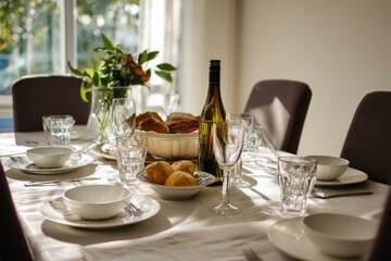 Elegant Table Setting with Wine, Bread, and Flowers for a Special Occasion