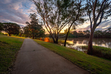 St George, QLD, Australia - Park and walking path along the Balonne River at sunset