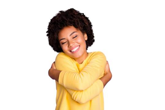 Photo of charming sweet pretty girlish feminine youngster hugging herself smiling toothily enjoying her newly bought yellow sweater of coziness isolated over pastel purple color background