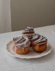 Sweet buns cruffin on a white plate - a delicious dessert