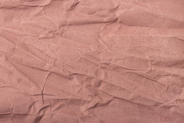 Abstract wrinkled muted mauve crumpled paper texture background