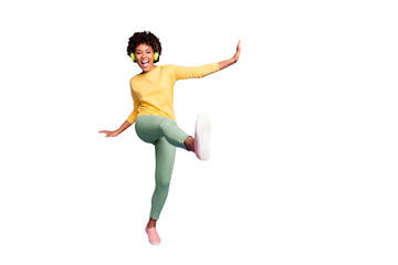 Full length body size photo of wavy ecstatic overjoyed shouting girlfriend dancing listening to music pretending to be kicking with leg near empty space isolated over violet color pastel background