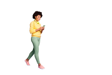 Full length body size view of her she nice attractive lovely cheerful cheery teen wavy-haired girl going listening music top chart isolated over violet purple lilac pastel color background