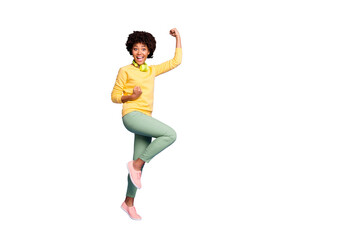 Full length body size photo of cute fascinating girl rejoicing found her favorite song she could not find for long wearing green pants trousers yellow sweater isolated violet pastel color background