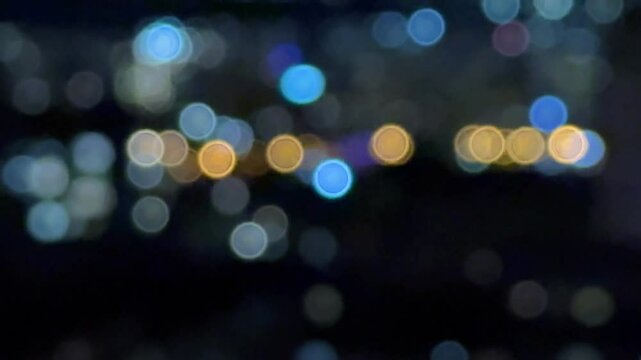 Night city and police lights with flashing lights of red and blue in the distance blurred