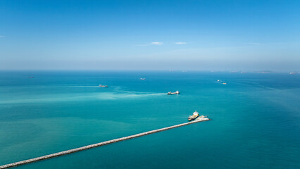 seascape and small ship floating in sea and blue sky backgrounds.