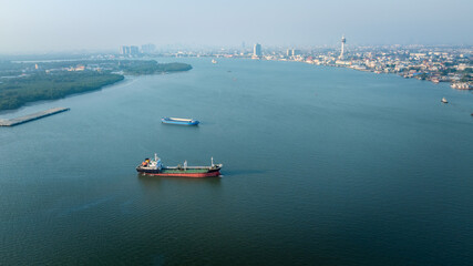 oil tanker ship floating at the mouth of the bay bangkok city backgrounds.