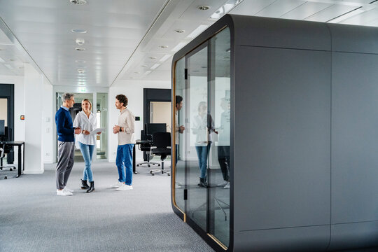 Colleagues having a business meeting in a modern office