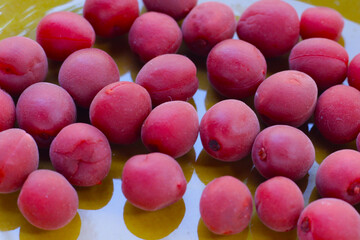 Umeboshi, Japanese pickled plums, Sour and salty taste.