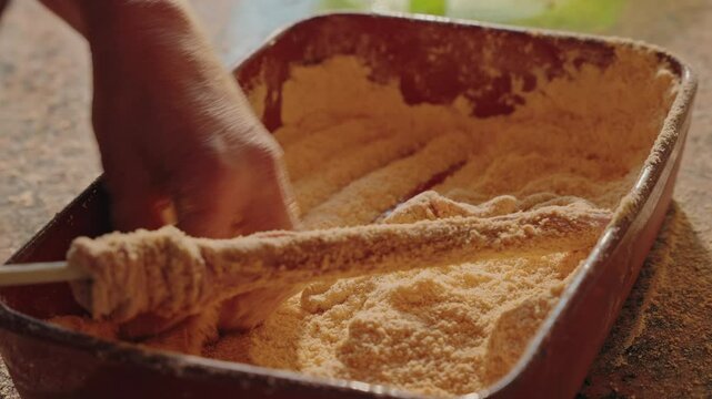 Pig tripe being rubbed with cornmeal during traditional cleaning process in northern Portugal