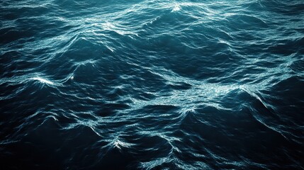 A deep ocean background with waves gently rippling, illuminated by the shimmering light from above, creating a calming effect.