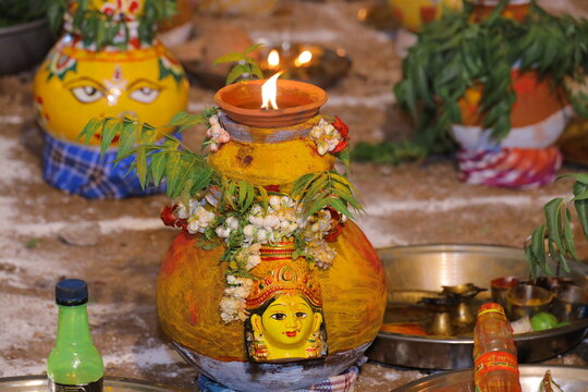 "A vibrant image of Bonalu festival showcasing the decorated goddess Thalli with traditional offerings and cultural devotion in Telangana, India."