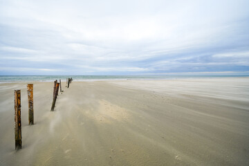 Beach on the Danish island of Rømø. Nature on the coast in Denmark. Minimalist landscape on the North Sea in pastel tones.
