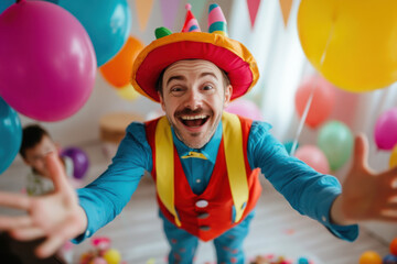 Cheerful clown reaching out for a hug at birthday party
