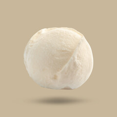 Ice cream scoop in air on beige background. Yummy dessert
