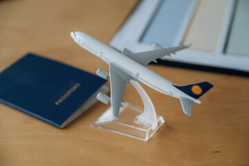 Detailed close up view of toy plane and passport