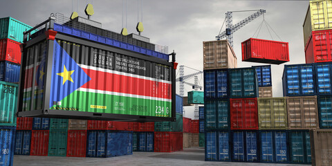 Fototapeta premium Cargo container with flag of South Sudan lifted by crane at freight terminal - 3D illustration