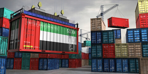 Fototapeta premium Cargo container with flag of United Arab Emirates lifted by crane at freight terminal - 3D illustration
