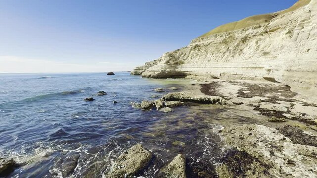 waves crashing on impressive cliffs on lovely Port Willunga Beach with clear water and stunning rock pools with marine wildlife. Fleurieu Peninsula, Onkaparinga, Adelaide, South Australia