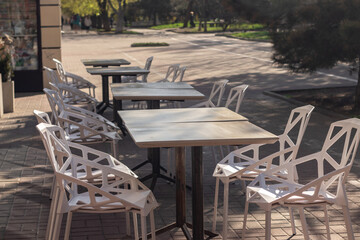 Summer terrace of a street cafe without people.