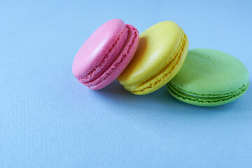 Colorful macaroon on blue background. Sweet macaroon.