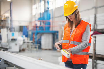 Female worker measuring pvc material