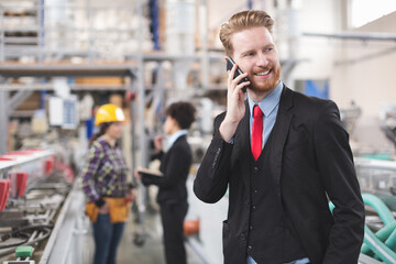 Quality inspector talking on mobile phone