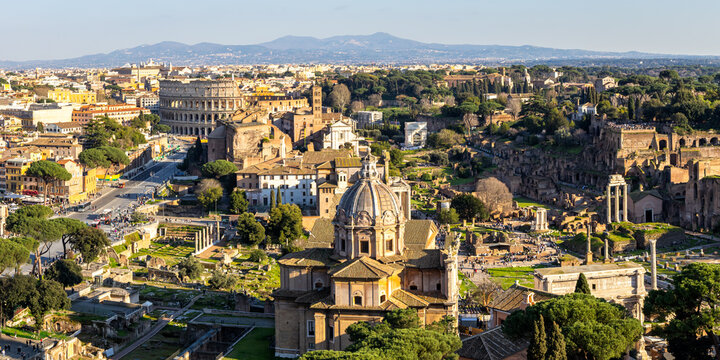 Rome skyline Roman Forum and Colosseum aerial view ancient historical temple ruins panorama in Italy