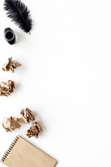 Writer or blogger workspace with notepad and ink, top view