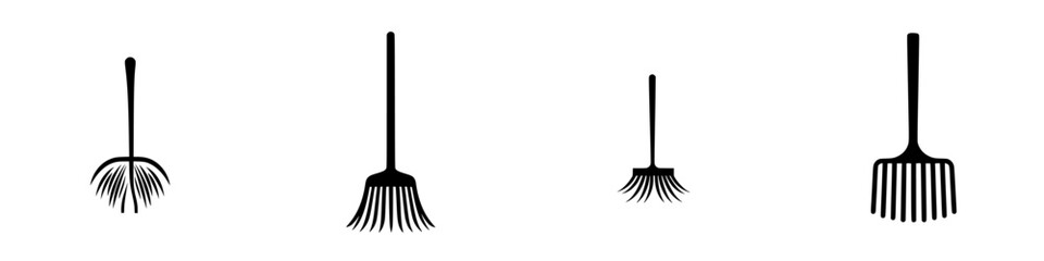 Obraz premium Black gardening tools including various rakes suitable for landscaping and yard work