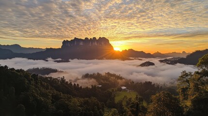 Majestic Sunrise Over Foggy Mountains