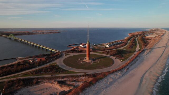 Gorgeous Fire Island and Robert Moses State Park, Long Island, NY. 4K aerial view of causeway, beaches, water tower at sunset.