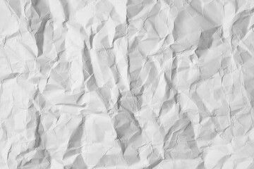 white crumpled wrinkled paper sheet